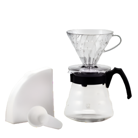 Coffee brewing set with glass carafe, filter, and paper on a white background